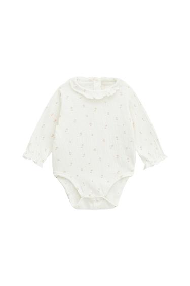 TEXTURED BODYSUIT WITH RUFFLE TRIM