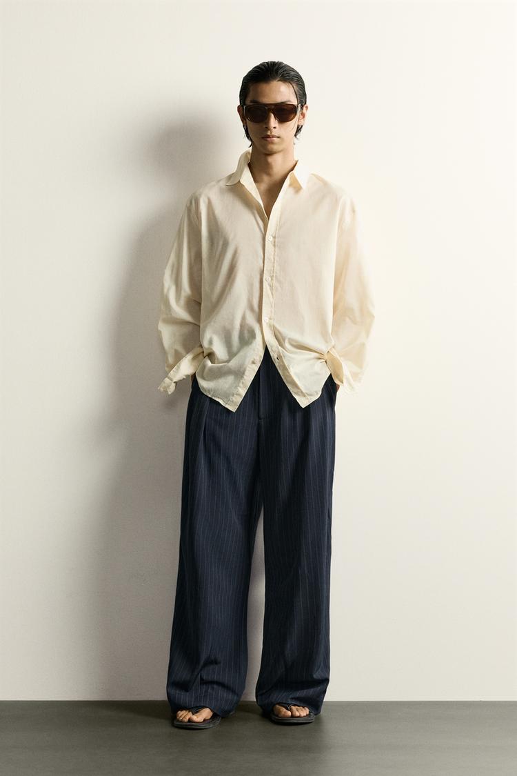 STRIPED RELAXED FIT PLEATED TROUSERS