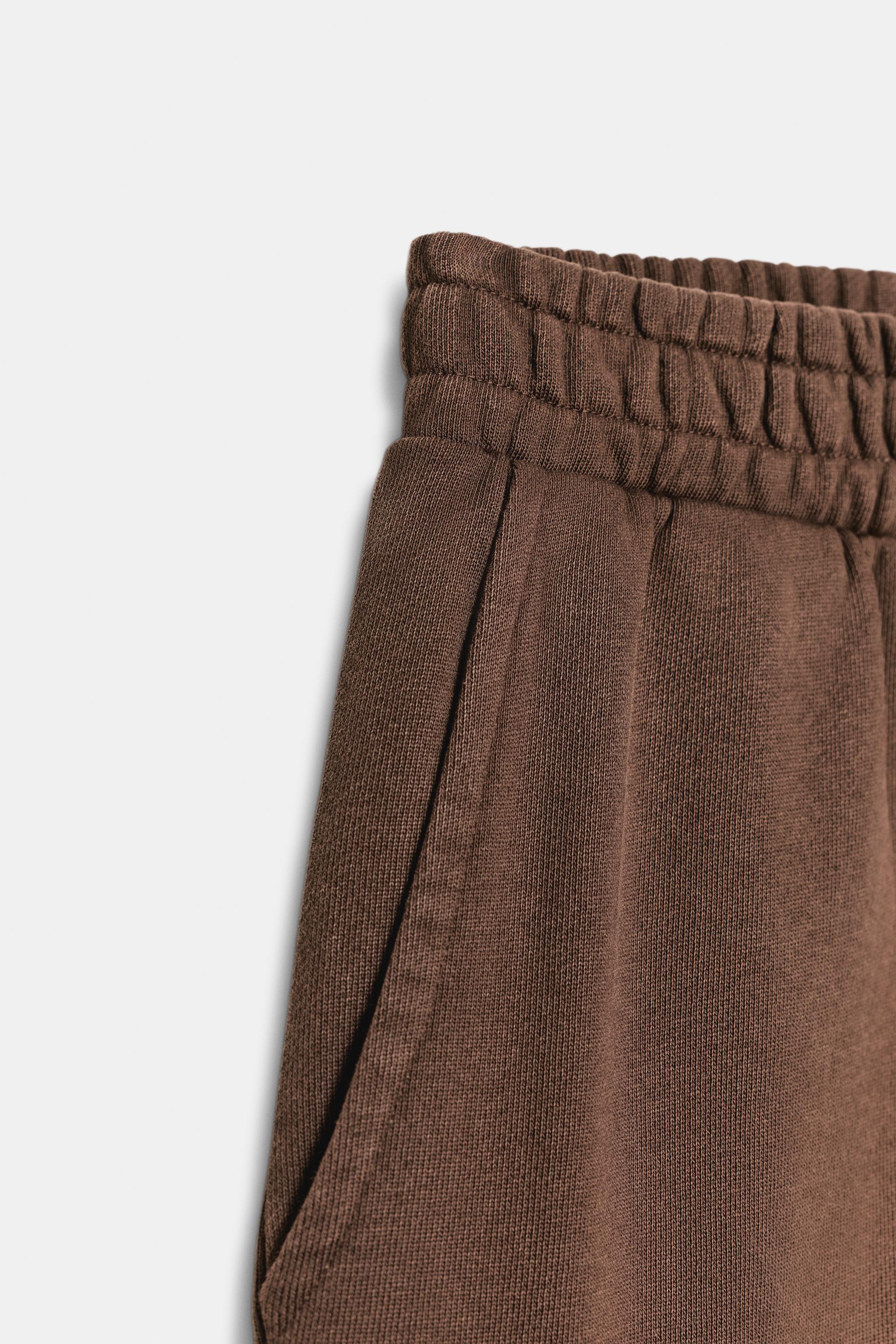 PANTALON EN MOLLETON EFFET DÉLAVÉ CLOUS