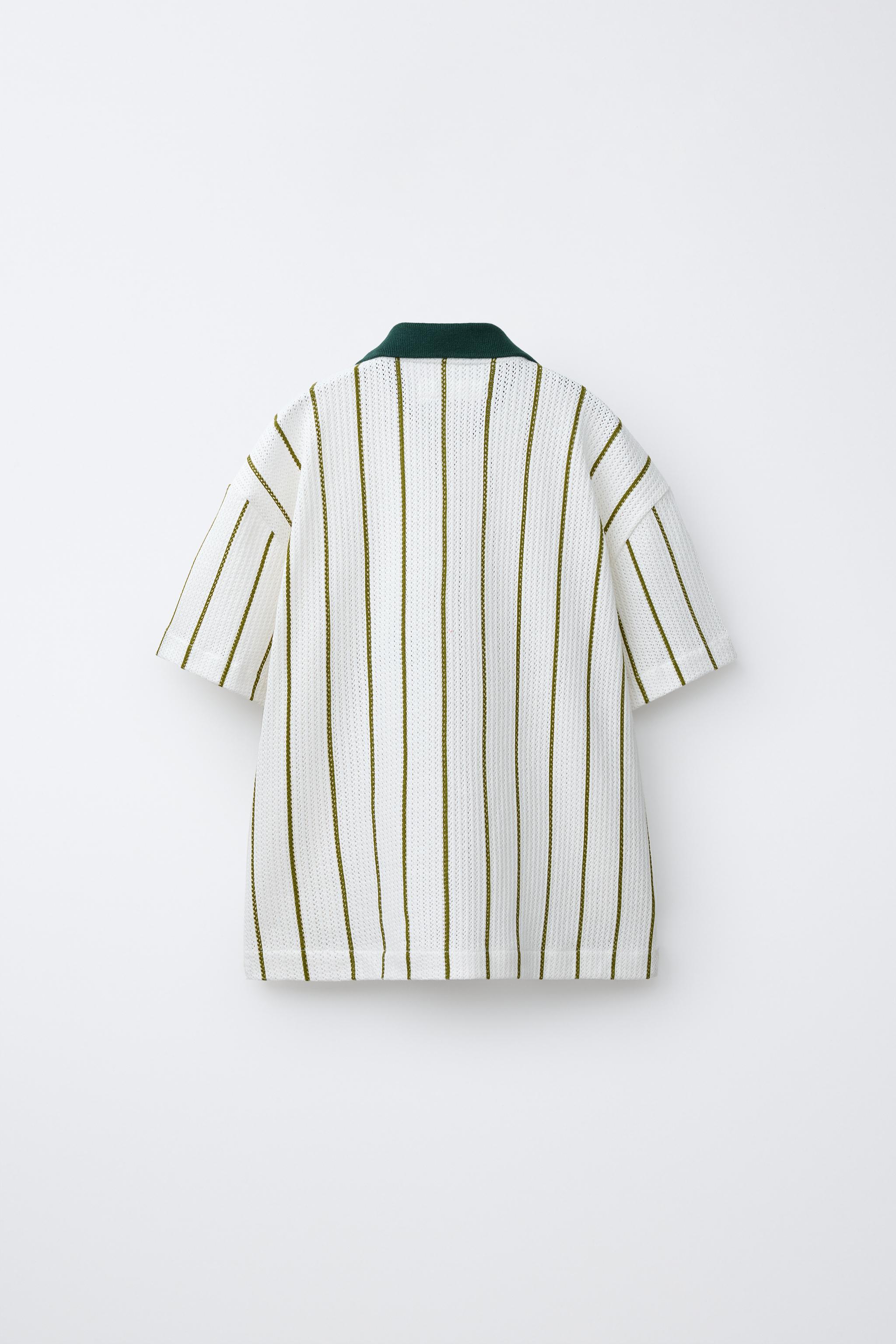 CHEMISE EN MAILLE À RAYURES AVEC INSCRIPTION