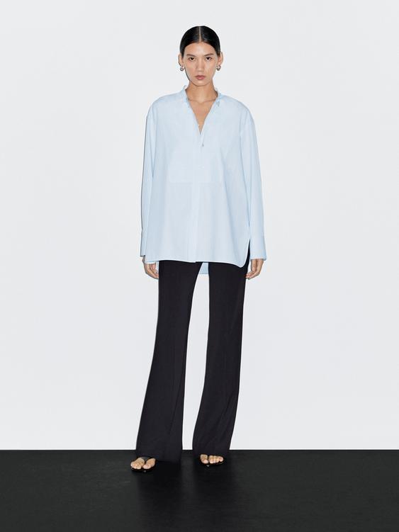 Shirt with stand collar and bib