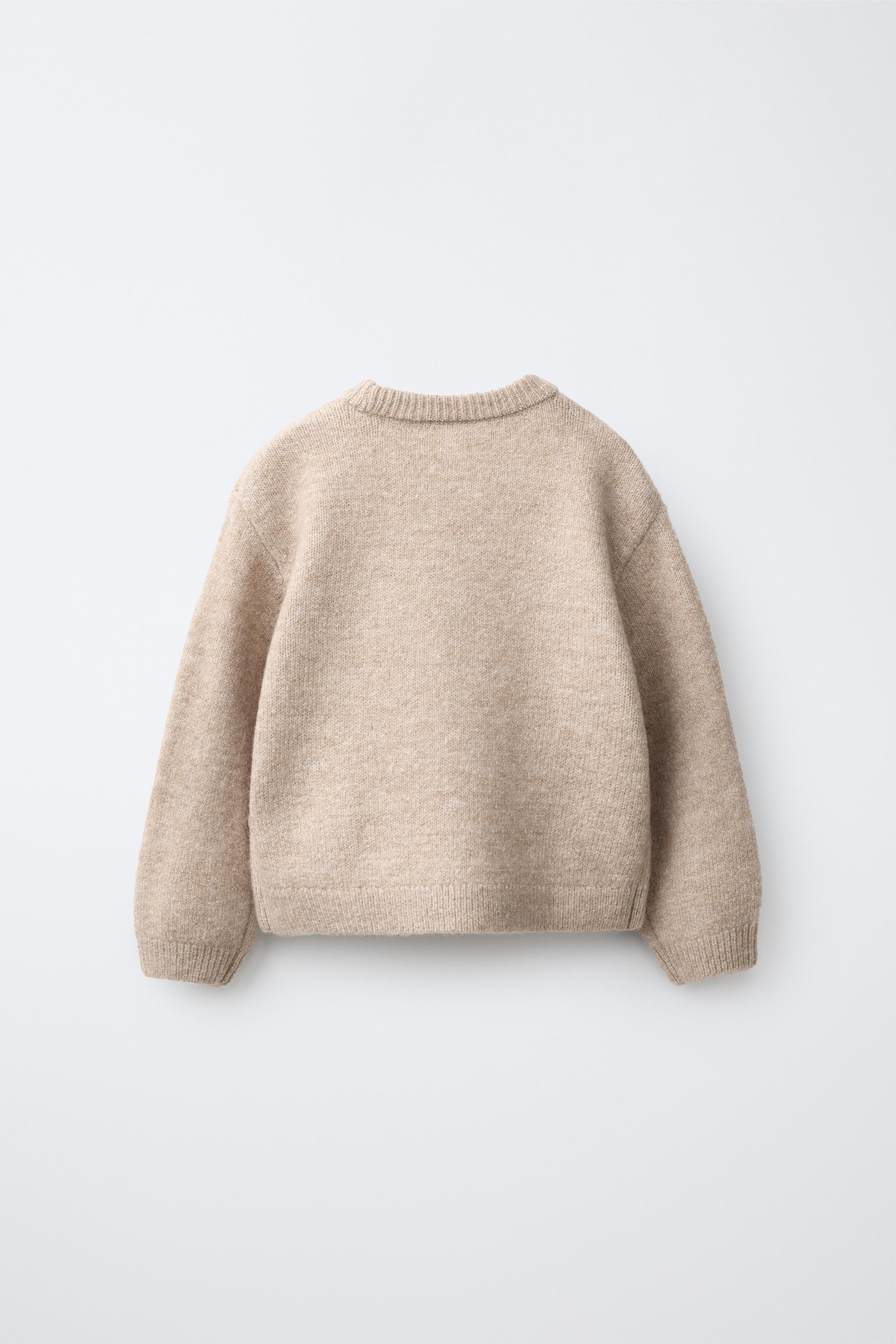 PULL EN MAILLE OURSONNE POMPOM