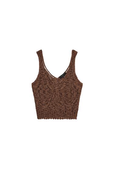 Front view of a brown knit top with wide straps and cutout design.
