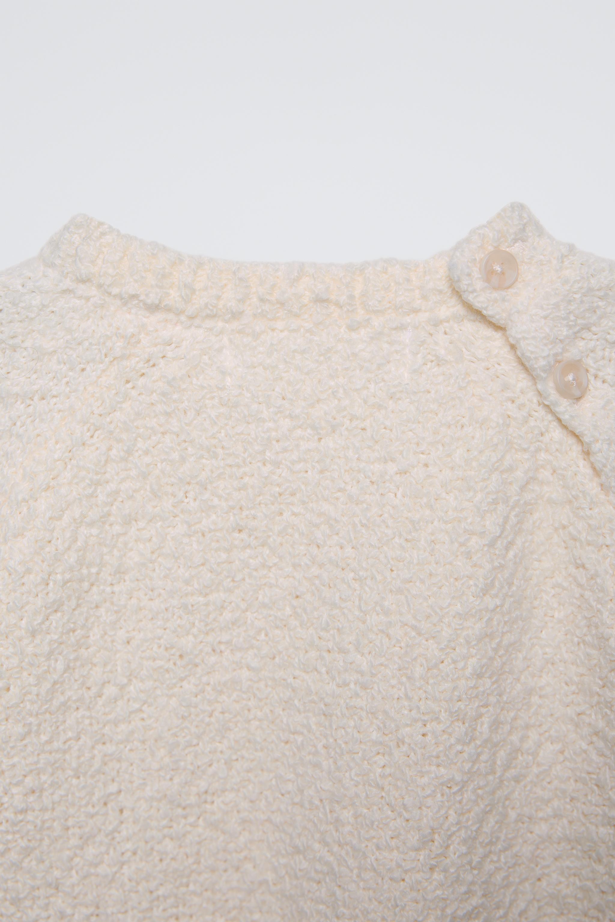 PULL EN MAILLE À TORSADES