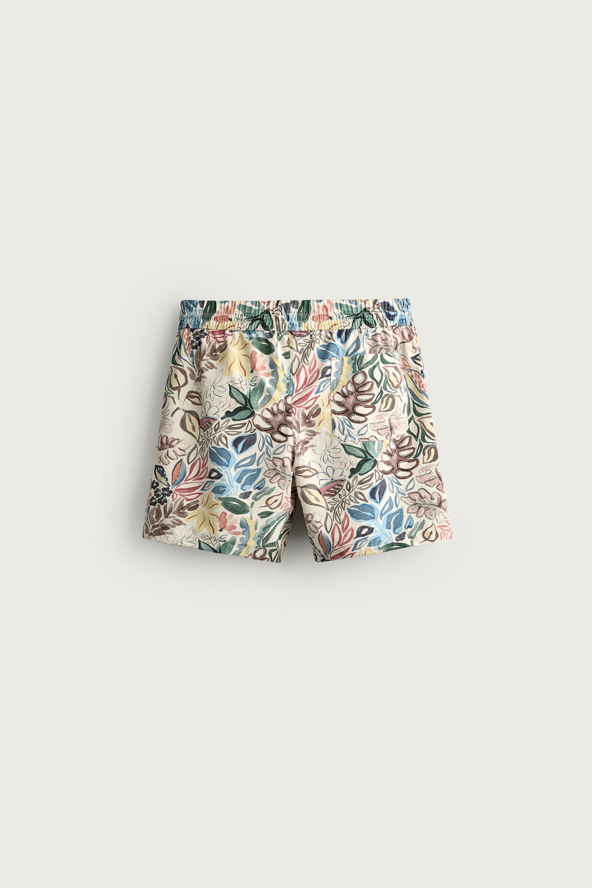 LONG FLORAL PRINT SWIM TRUNKS