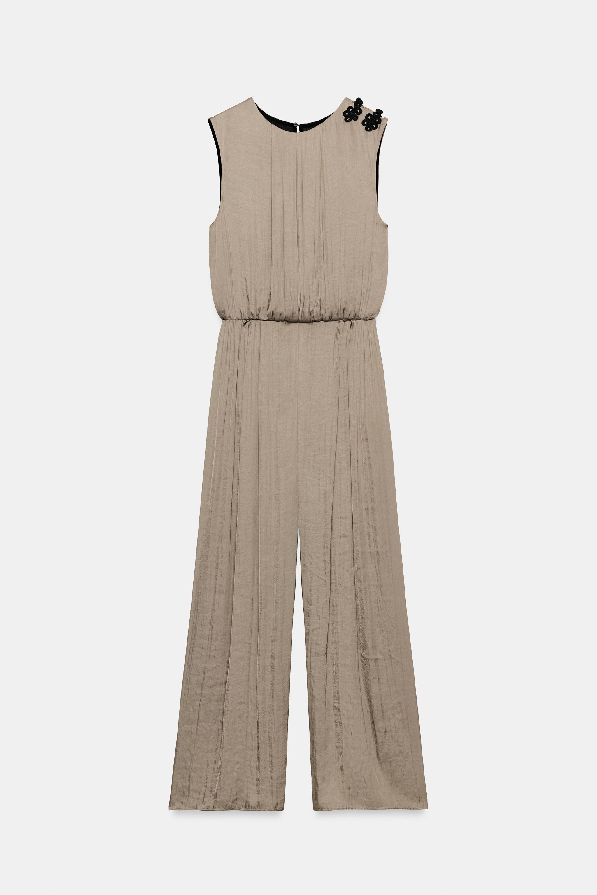 SATIN JUMPSUIT WITH SHOULDER FROG FASTENING
