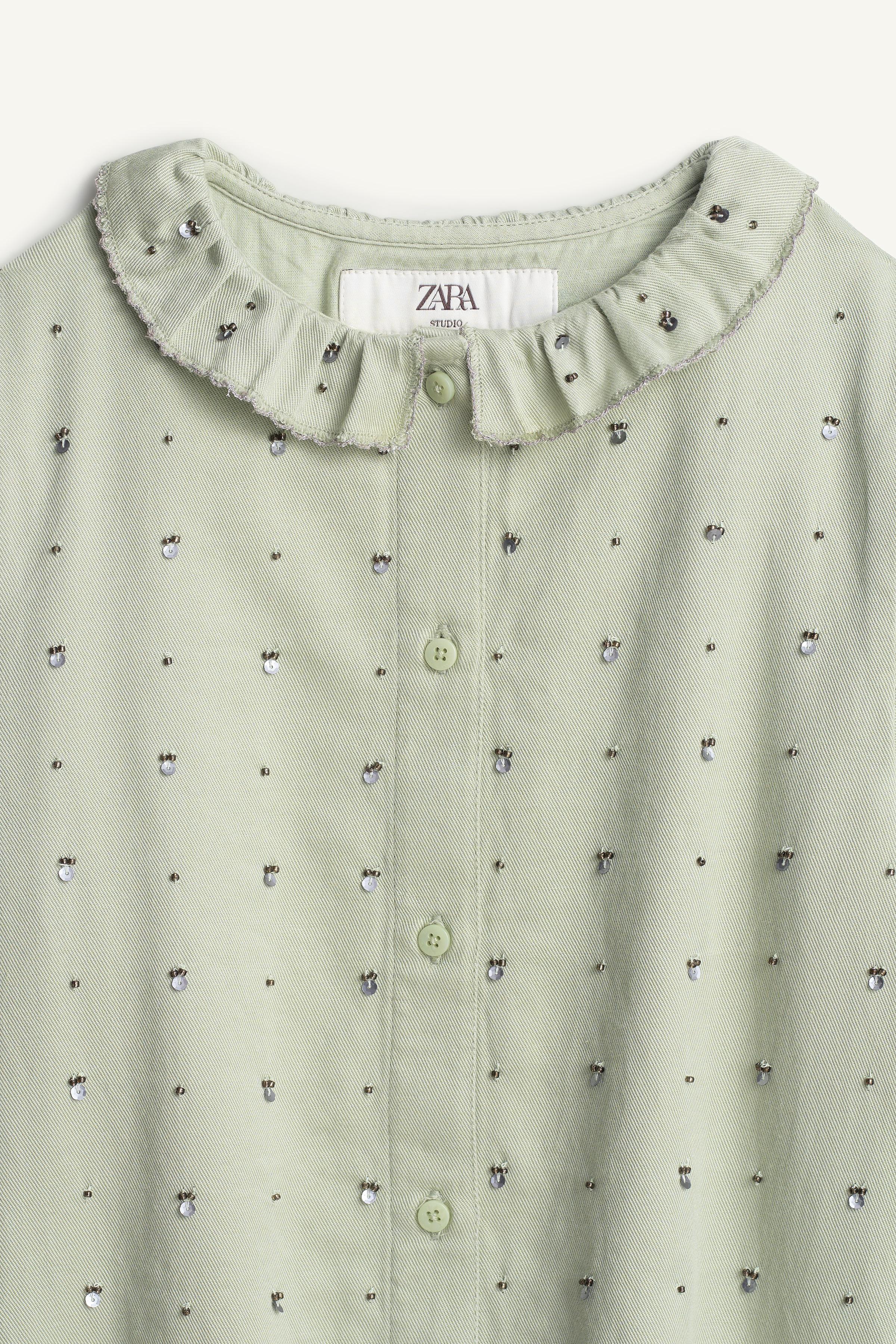 LIMITED EDITION SEQUIN RUFFLE NECK BLOUSE