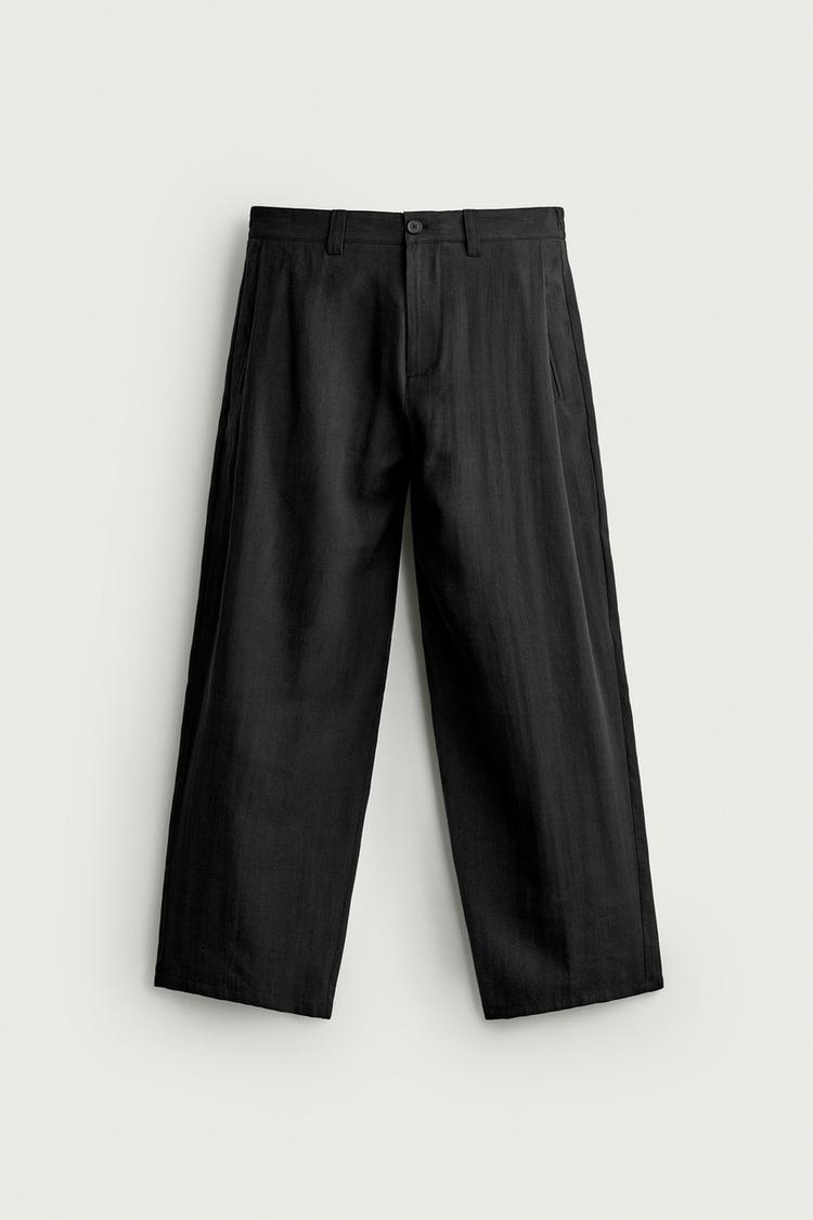 Pantalones fluidos con pliegues laterales 7