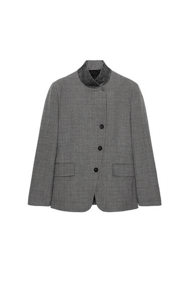 Front view of a medium grey blazer with a high collar, button fastening, and front flap pockets.