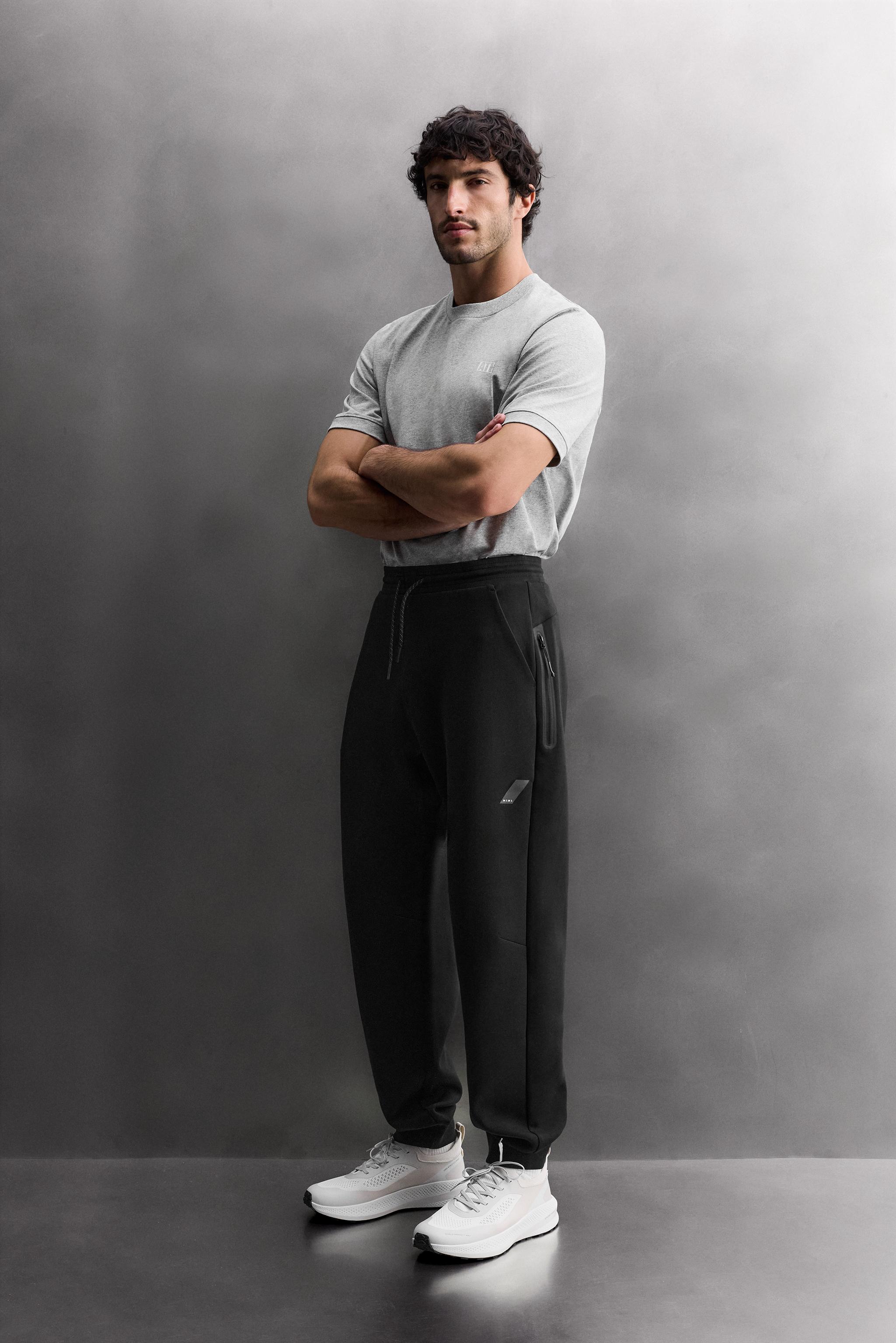 TECHNICAL PANTS WITH ZIPPERS