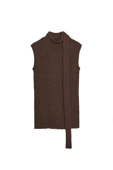Front view of a sleeveless brown top, visible texture, high neck and long scarf detail in the same fabric.