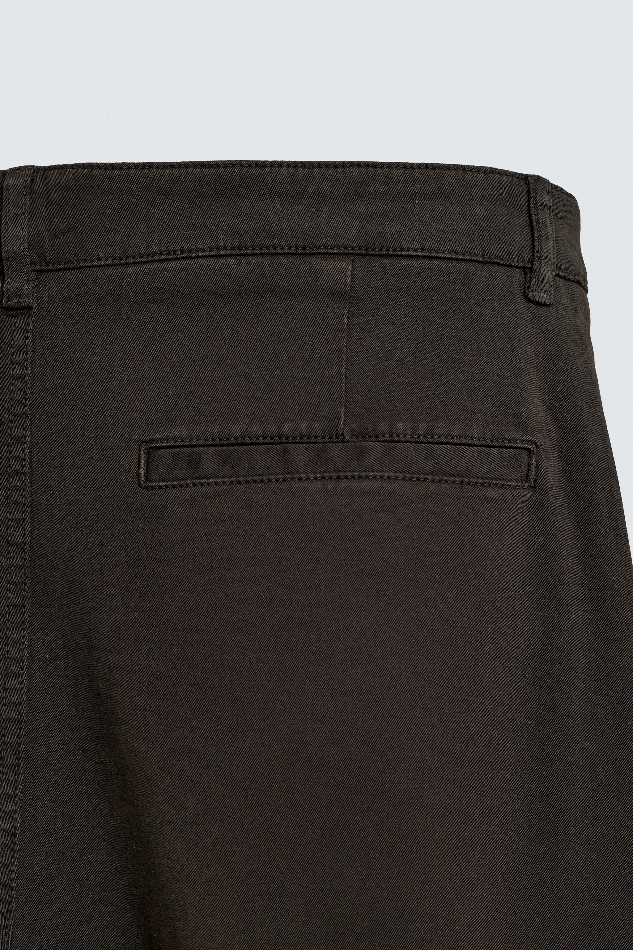 RELAXED FIT PLEATED PANTS