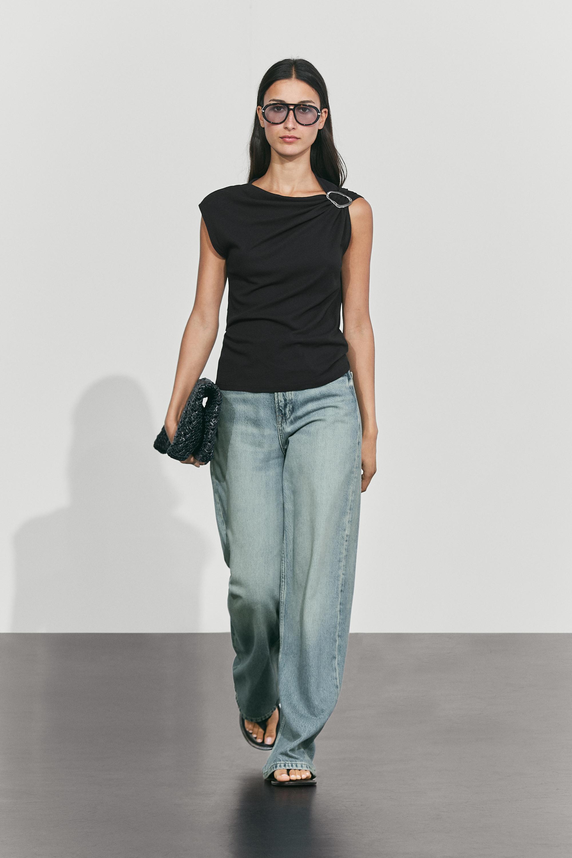 Asymmetric metal detail top