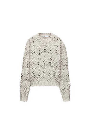 CABLE KNIT SWEATER WITH POMPOMS