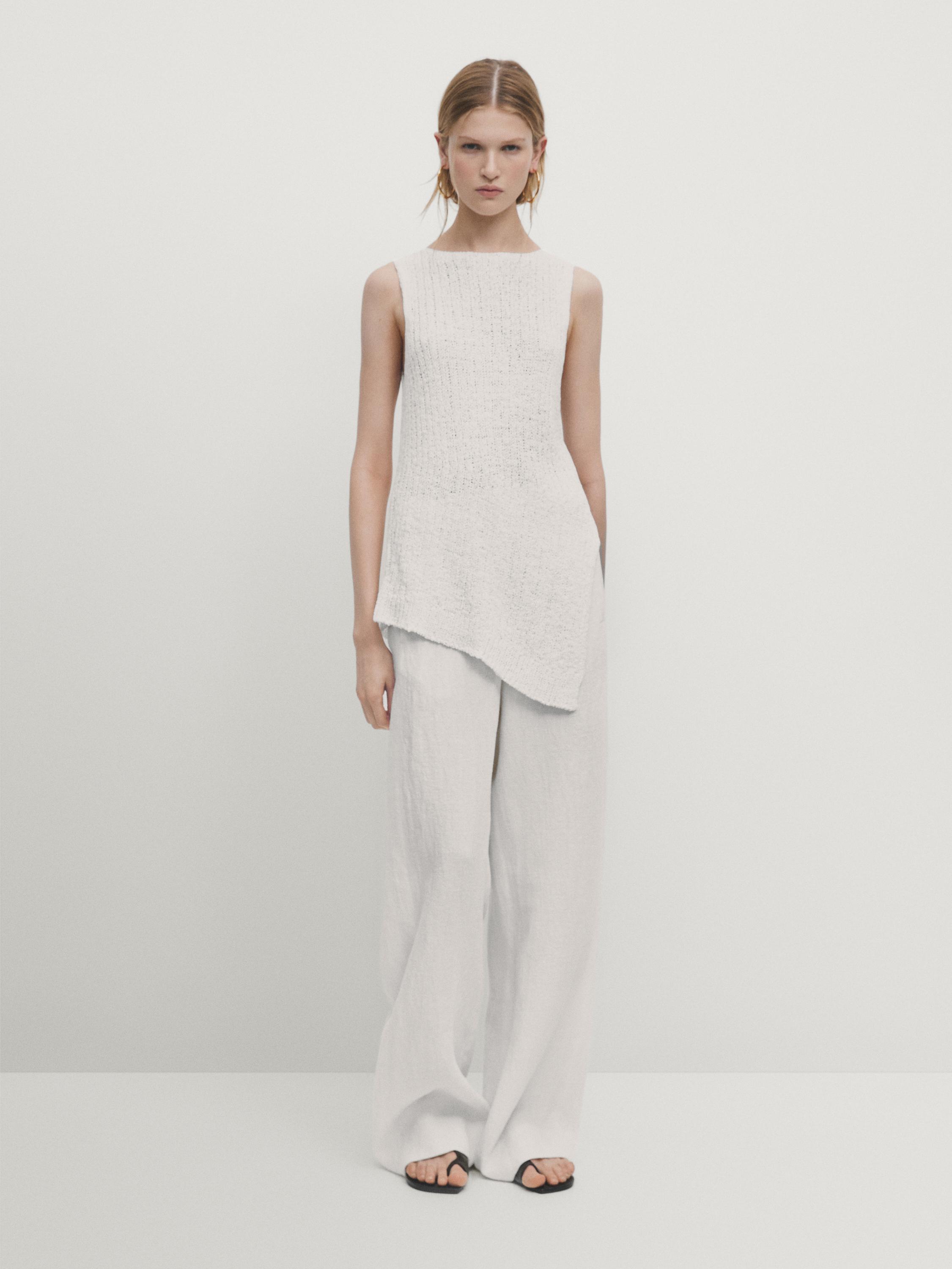 Knit top with asymmetric hem