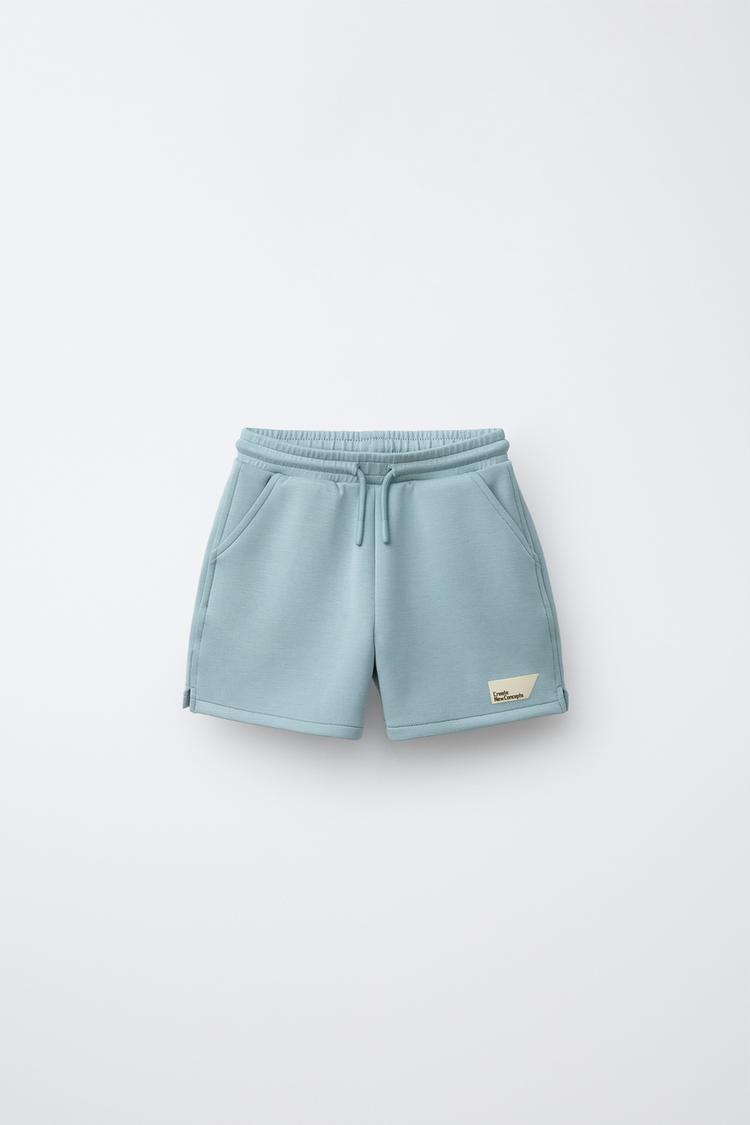 Bermuda Interlock Etiqueta