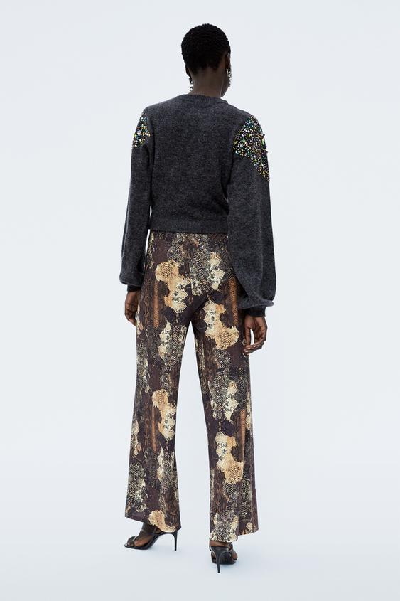 Image 4 of SNAKESKIN PRINT TROUSERS from Zara