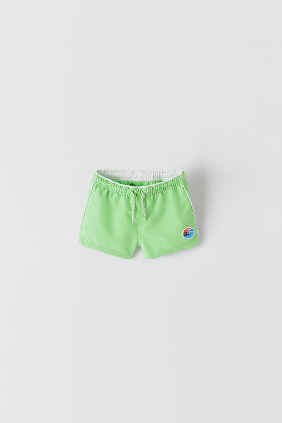 SWIM SHORTS WITH PATCH