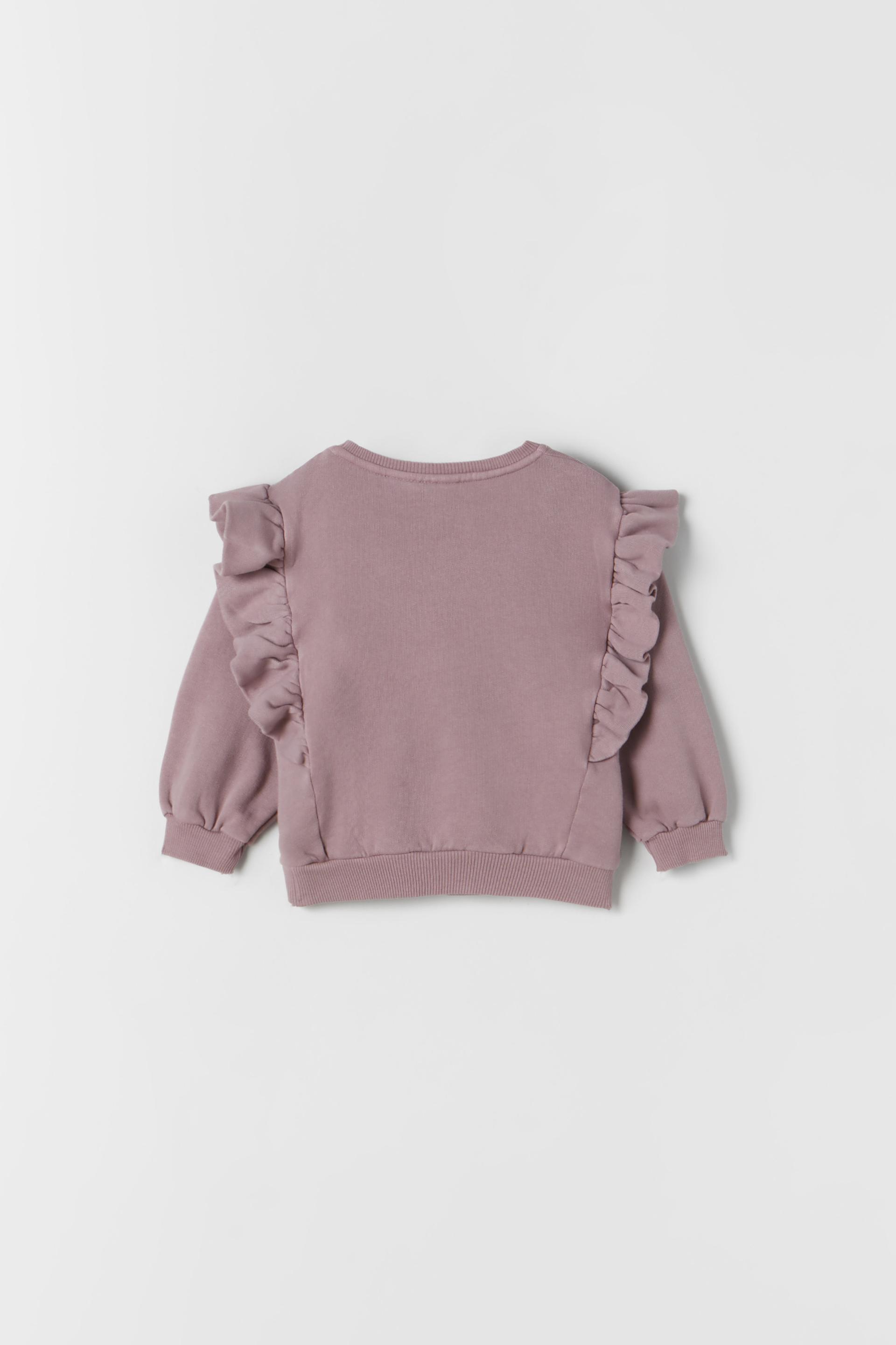 pink ruffle sweater