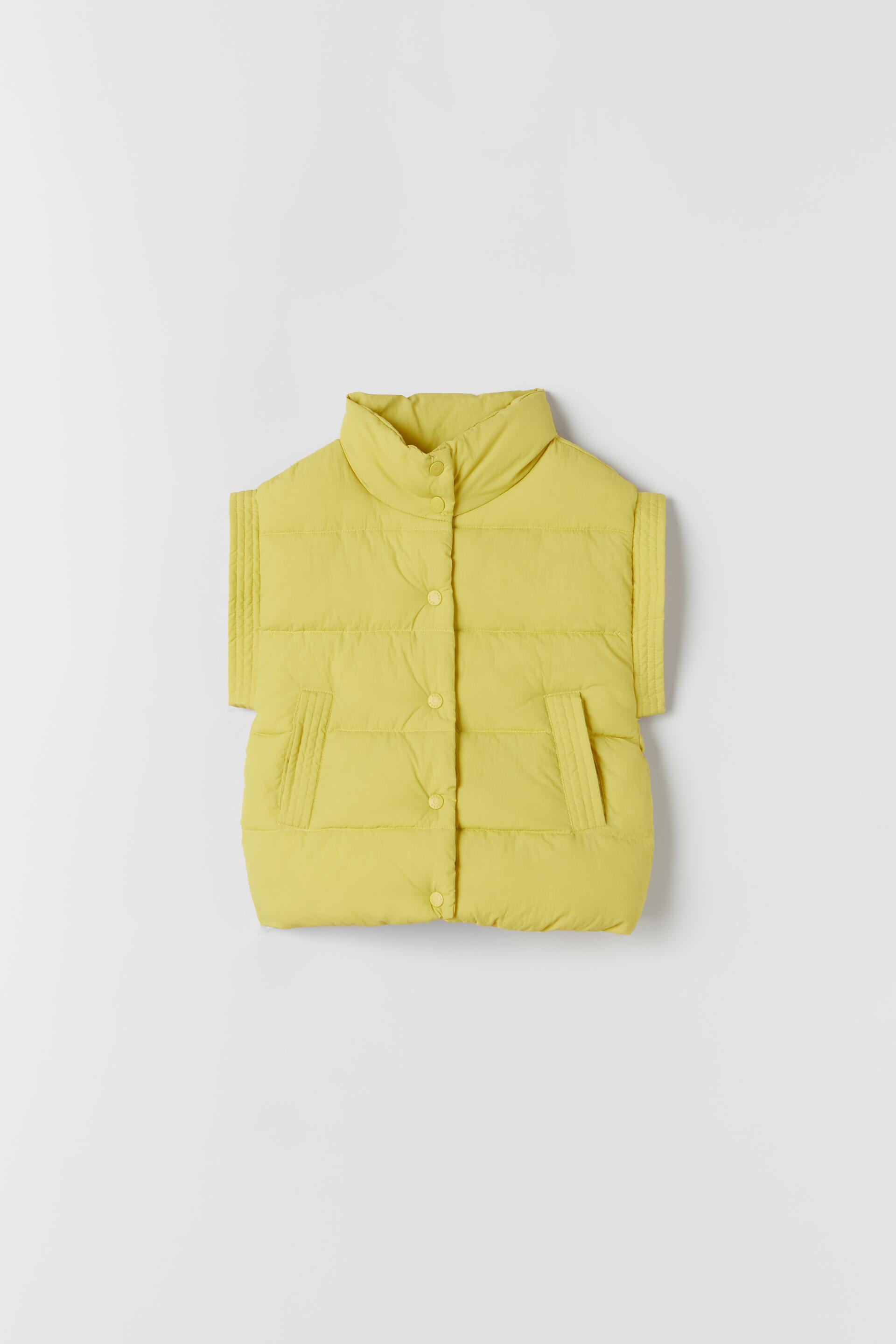 yellow puffer vest