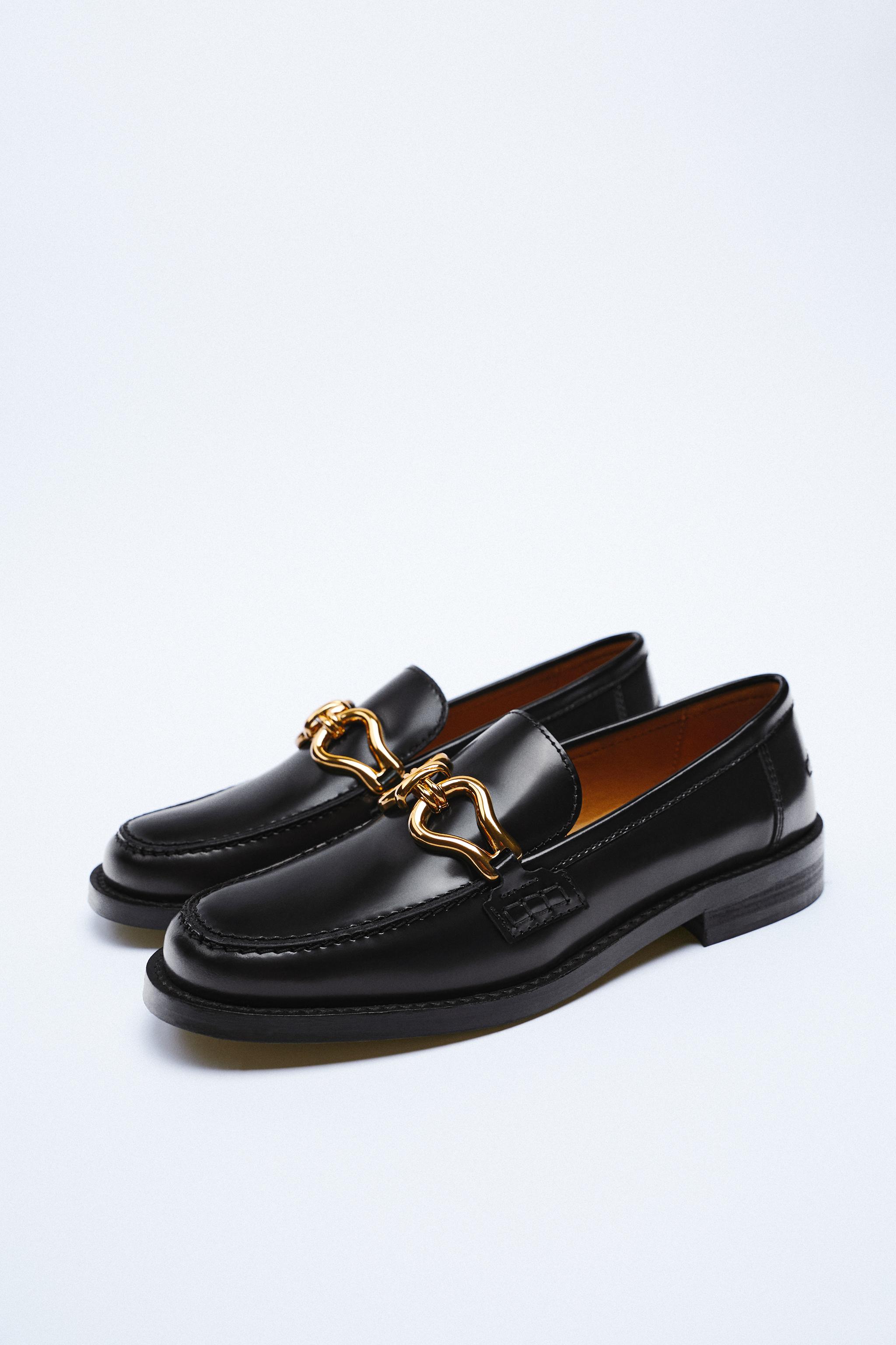 Black Flat leather loafers with metal buckle detail. AIRFIT®. Flexible technical latex foam insole, designed to offer greater comfort.