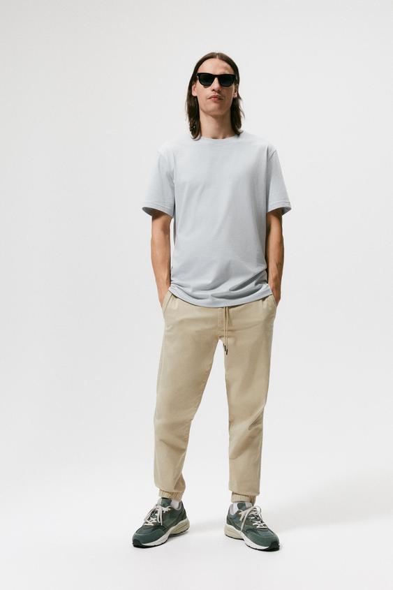 CALÇA DE CINTURA JOGGER COM PREGAS - Bege | ZARA Brasil