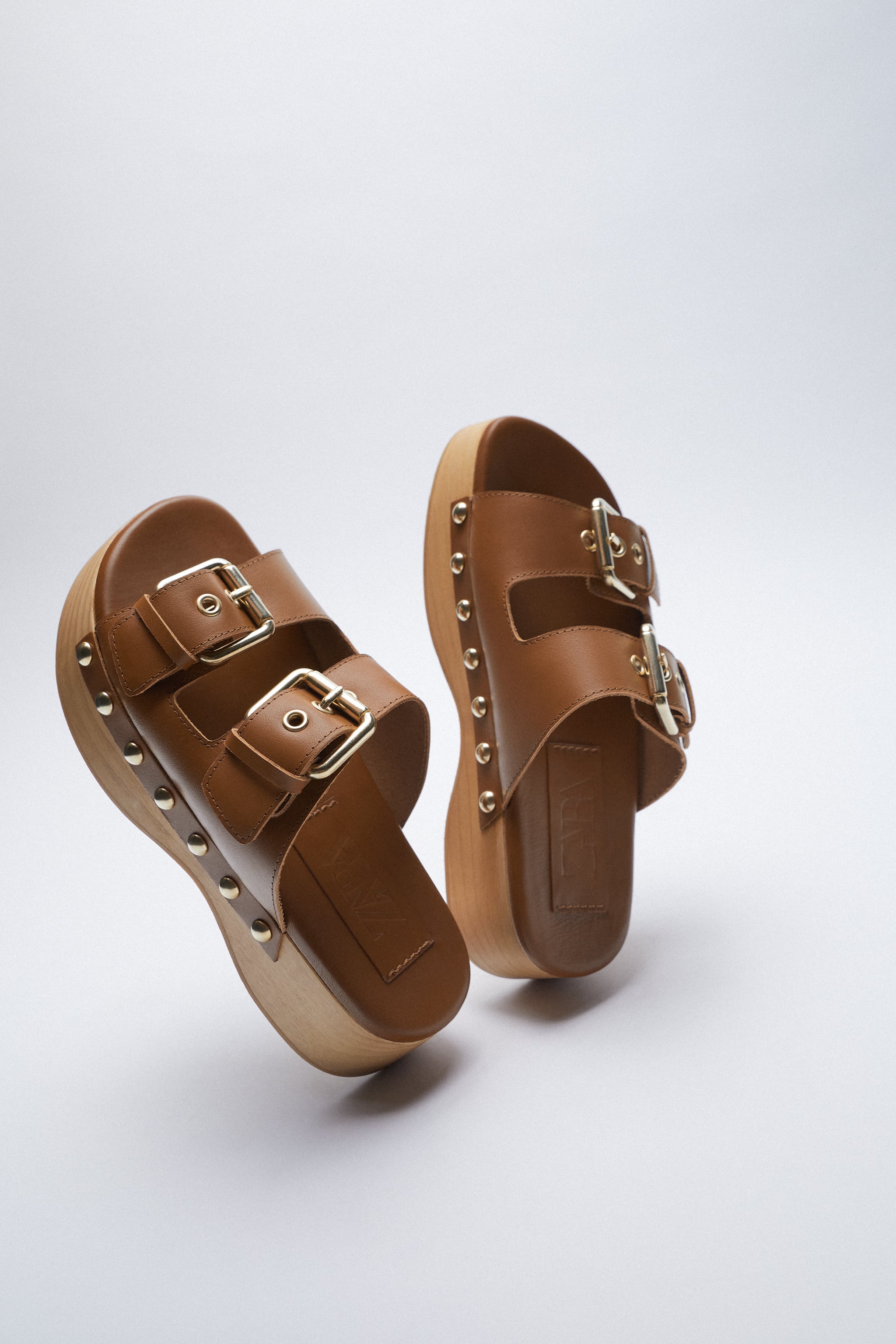 Tan buckled leather blogs with straps and gold studs from Zara