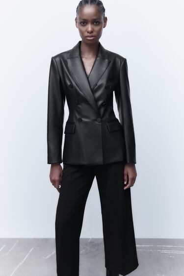 Image 0 of Long sleeve lapel collar blazer. Front flap pockets. Back slit. Front double breasted closure with tonal lined buttons. from Zara