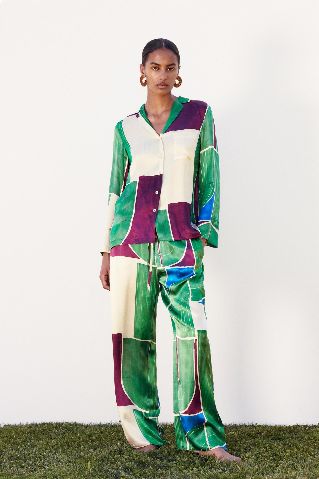 Zara Limited Edition Green, Purple, and Green Geometric printed shirt in 100% silk. Collared, V-neckline, and long sleeves with cuffs. Chest patch pocket. Split hem. Button-down front with matching buttons.