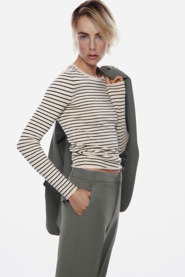 Image 0 of KNIT SWEATER WITH ROLLING TRIMS from Zara