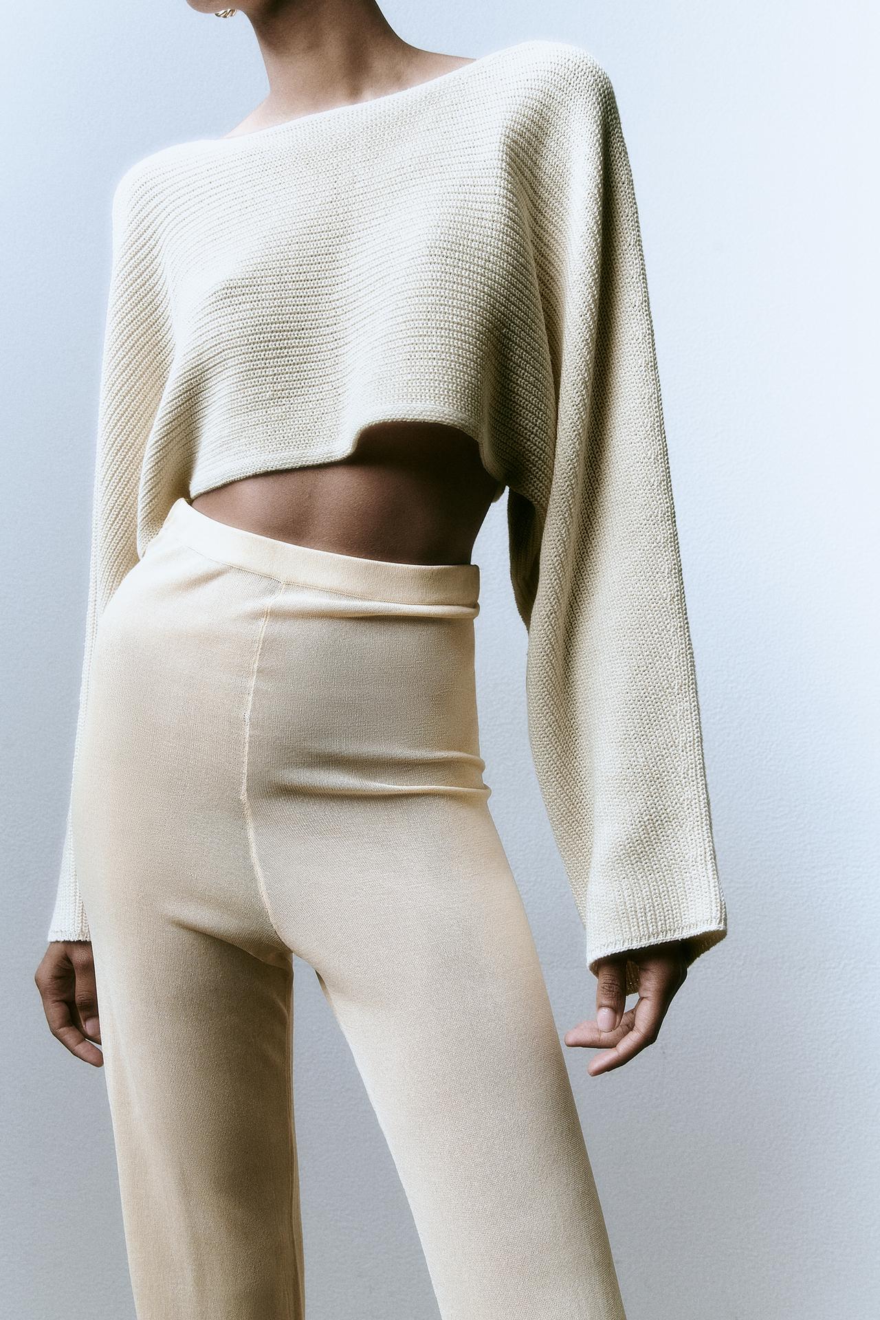 Zara Ecru Cropped round neck sweater with long loose sleeves and a back opening detail.