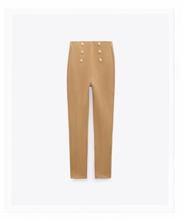 Image 0 of High-waisted leggings with elastic waistband. Front gold false buttons. from Zara