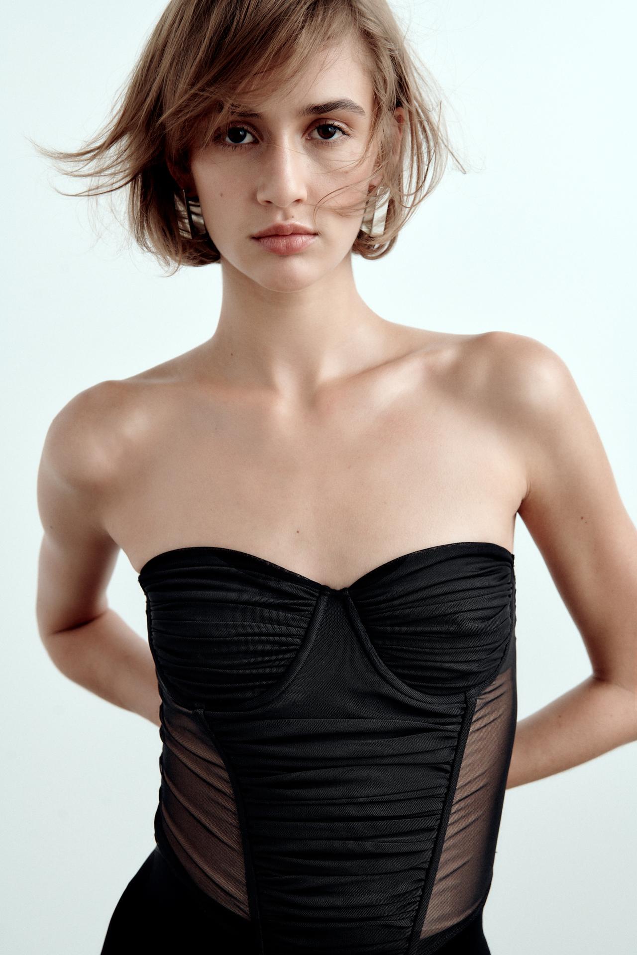 Zara black tulle corset featuring underwires, a sweetheart neckline and cup features. It has sheer panelling at the sides.