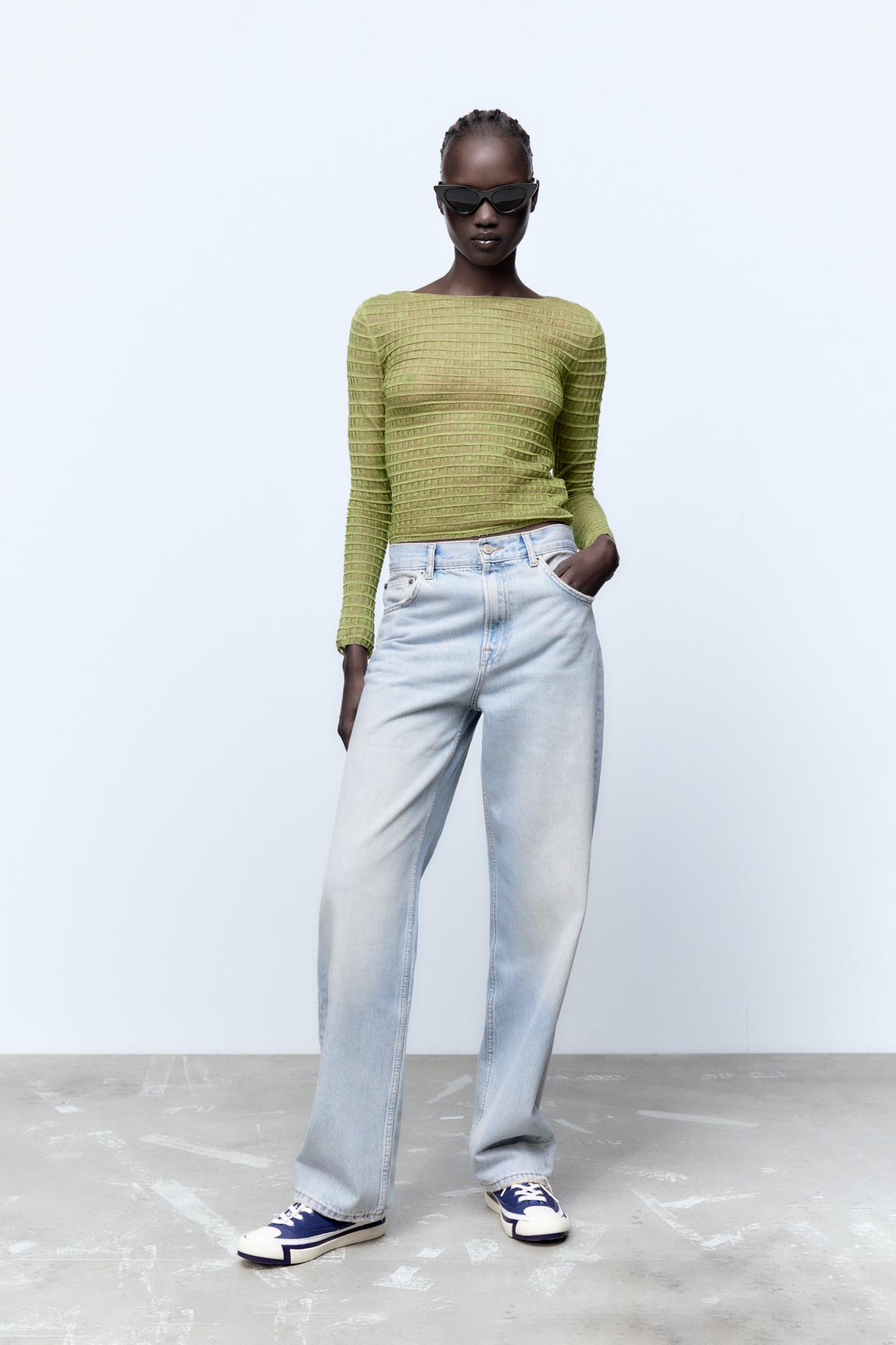 Zara new season sheer textured knit sweater in a chartreuse green shade. It has a fitted silhouette, long sleeves and a slash neck. It is textured and sheer.