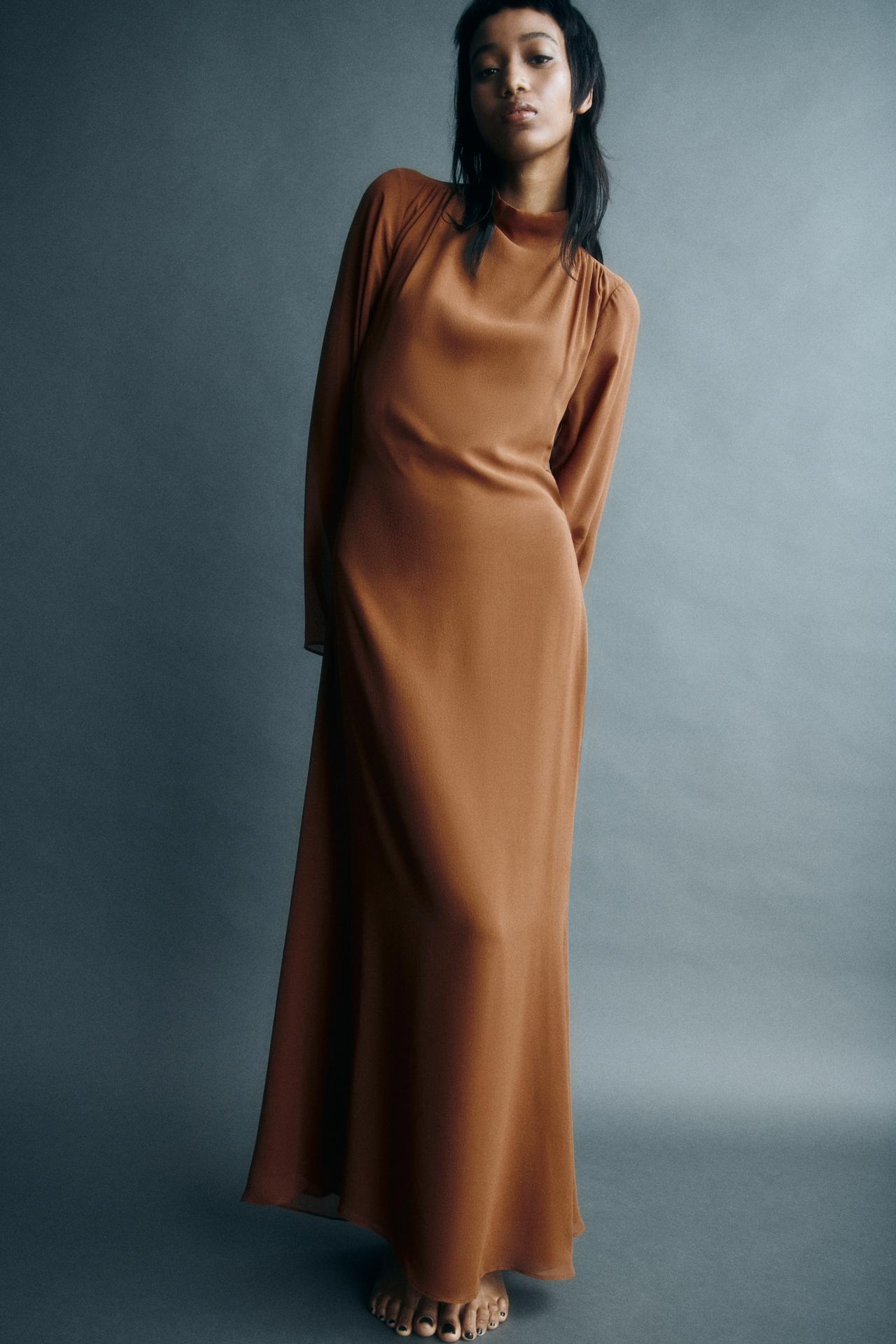 Zara New In Brown Long silk dress. High neck and long sleeves with flared trims. Pleated details at the shoulders. Vent at the hem. Button fastening on the collar.