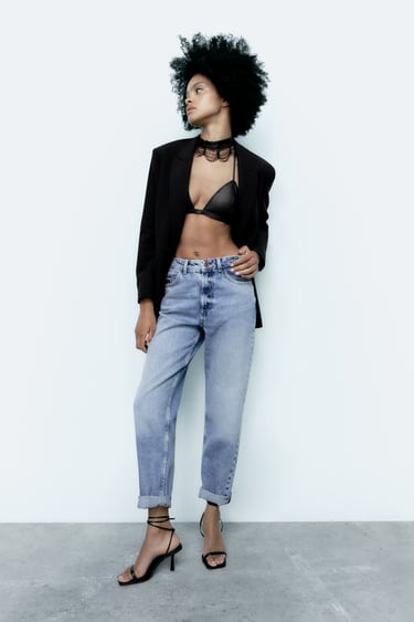 Image 0 of High rise five pocket jeans. Straight leg and turned-up cuffs. Front zip and metal button closure. from Zara