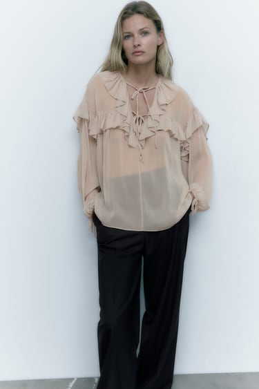 Image 0 of SEMI-SHEER BLOUSE WITH RUFFLE TRIMS from Zara