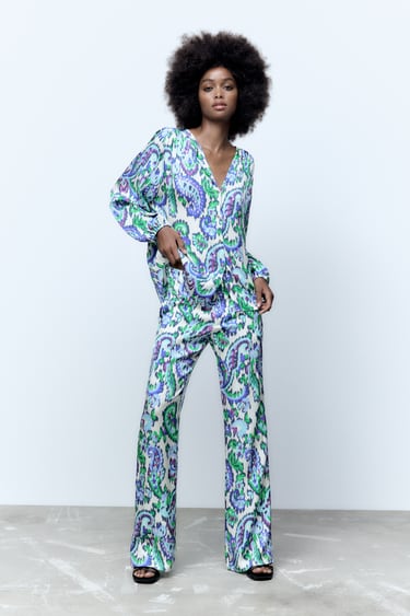 Image 0 of PRINTED FLARED TROUSERS from Zara