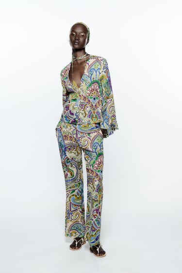 Image 0 of PRINTED FLARED TROUSERS from Zara