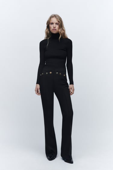 Image 0 of METAL BUTTONED FLARED PANTS from Zara