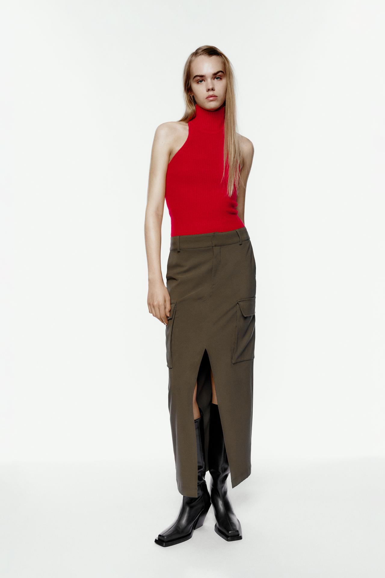 Zara Long cargo maxi skirt in khaki. This on trend maxi skirt comes with belt loops, side pockets and cargo style patch pockets with flaps on the leg. Front slit at the hem for movement. this is a tailored take on the cargo maxi skirt trend.