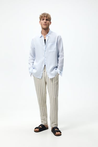 Image 0 of STRIPED TEXTURED TROUSERS from Zara