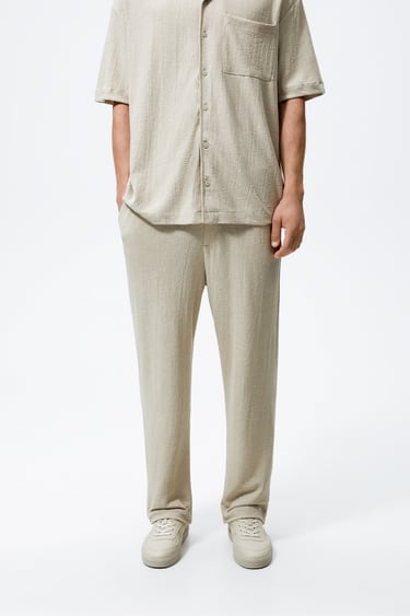 Image 0 of CREASED-EFFECT TROUSERS from Zara
