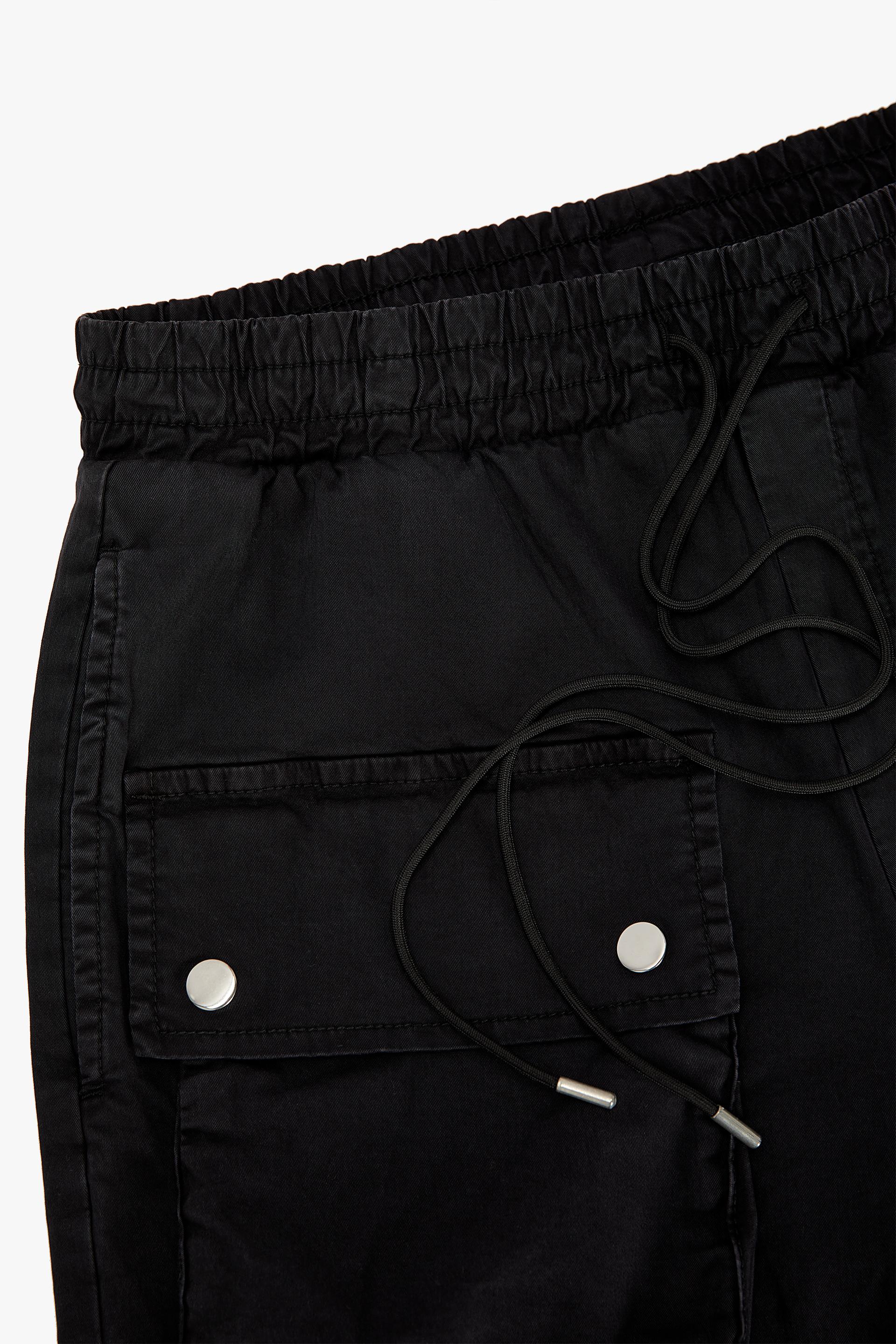 X RHUIGI CARGO PANTS