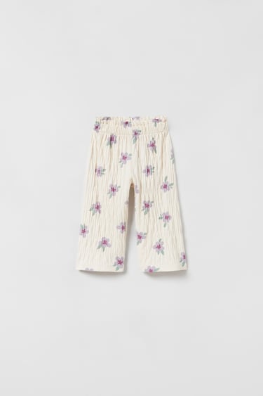 Image 0 of TEXTURED FLORAL PRINT TROUSERS from Zara