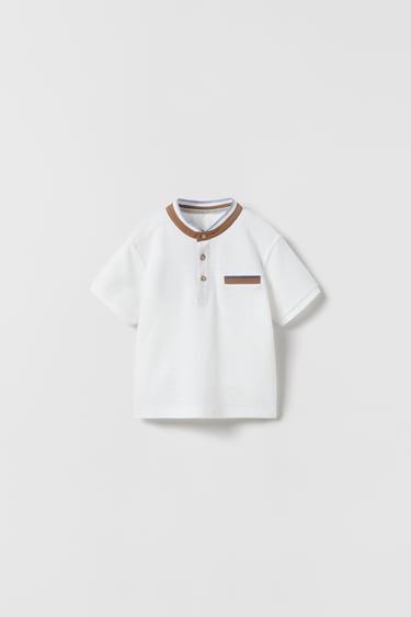 Image 0 of POLO SHIRT WITH CONTRAST FAUX SUEDE TRIMS from Zara