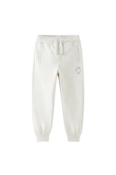 Image 0 of BASIC PLUSH TROUSERS WITH SLOGAN PRINT from Zara