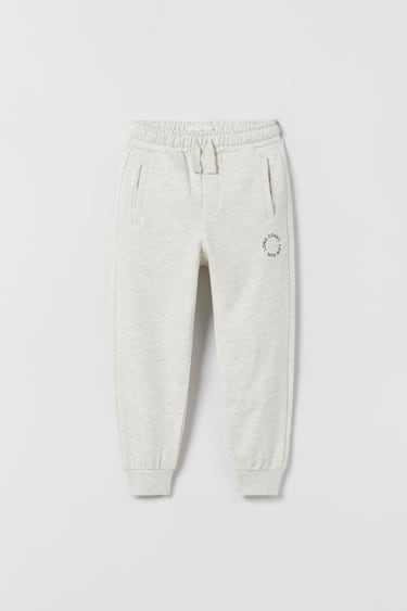 Image 0 of BASIC PLUSH TROUSERS WITH SLOGAN PRINT from Zara
