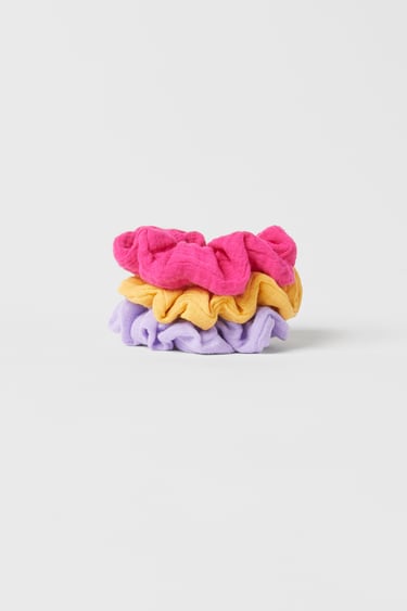 Image 0 of PACK OF THREE PLAIN COLOURED TEXTURED SCRUNCHIES from Zara