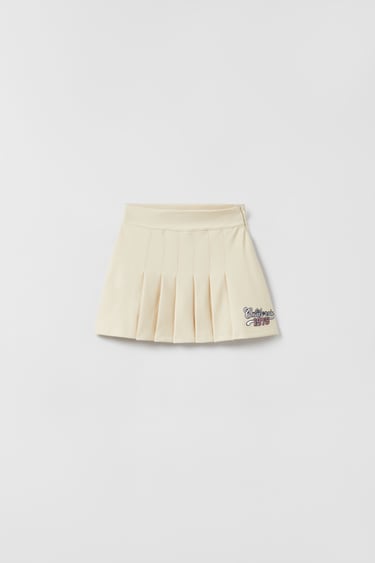 BOX PLEAT SKIRT WITH PATCH